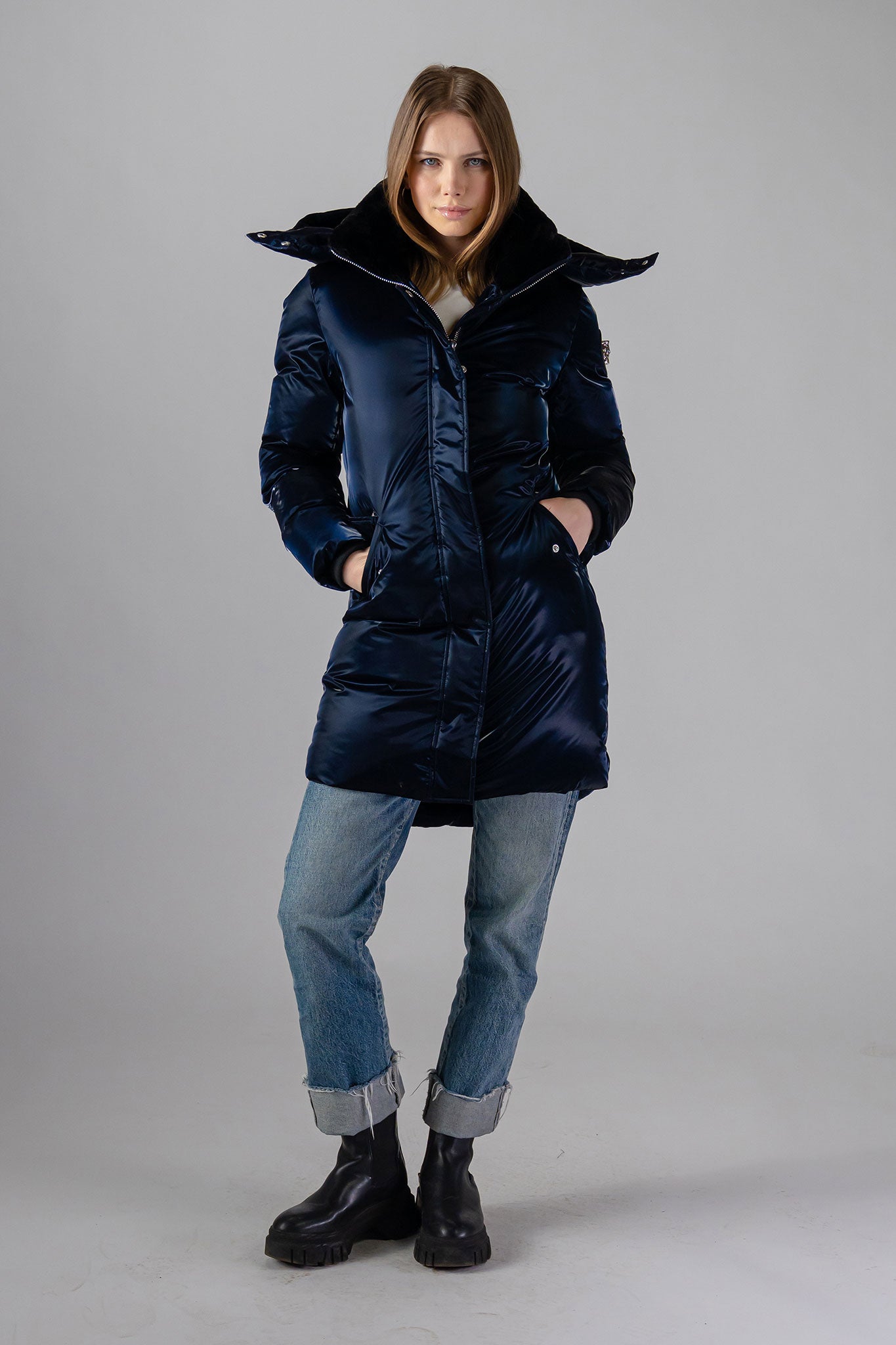 Woodpecker Women&#39;s Unquilted Penguin Long Winter coat. High-end Canadian designer winter coat for women in &quot;All Wet Navy&quot; colour. Woodpecker cruelty-free winter coat designed in Canada. Women&#39;s heavy weight long length premium designer jacket for winter. Superior quality warm winter coat for women. Moose Knuckles, Canada Goose, Mackage, Montcler, Will Poho, Willbird, Nic Bayley. Extra warm. Shiny parka. Stylish winter jacket. Designer winter coat.