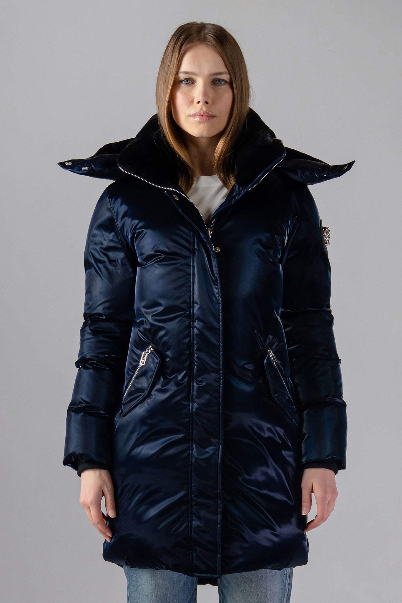 Woodpecker Women&#39;s Unquilted Penguin Long Winter coat. High-end Canadian designer winter coat for women in &quot;All Wet Navy&quot; colour. Woodpecker cruelty-free winter coat designed in Canada. Women&#39;s heavy weight long length premium designer jacket for winter. Superior quality warm winter coat for women. Moose Knuckles, Canada Goose, Mackage, Montcler, Will Poho, Willbird, Nic Bayley. Extra warm. Shiny parka. Stylish winter jacket. Designer winter coat.