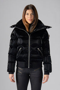 Woodpecker Women's Woody Bomber Winter coat. High-end Canadian designer winter coat for women in shiny “All Wet Black". Woodpecker cruelty-free winter coat designed in Canada. Women's heavy weight short length premium designer jacket for winter. Superior quality warm winter coat for women. Moose Knuckles, Canada Goose, Mackage, Montcler, Will Poho, Willbird, Nic Bayley. Shiny parka. Stylish winter jacket. Designer winter coat.