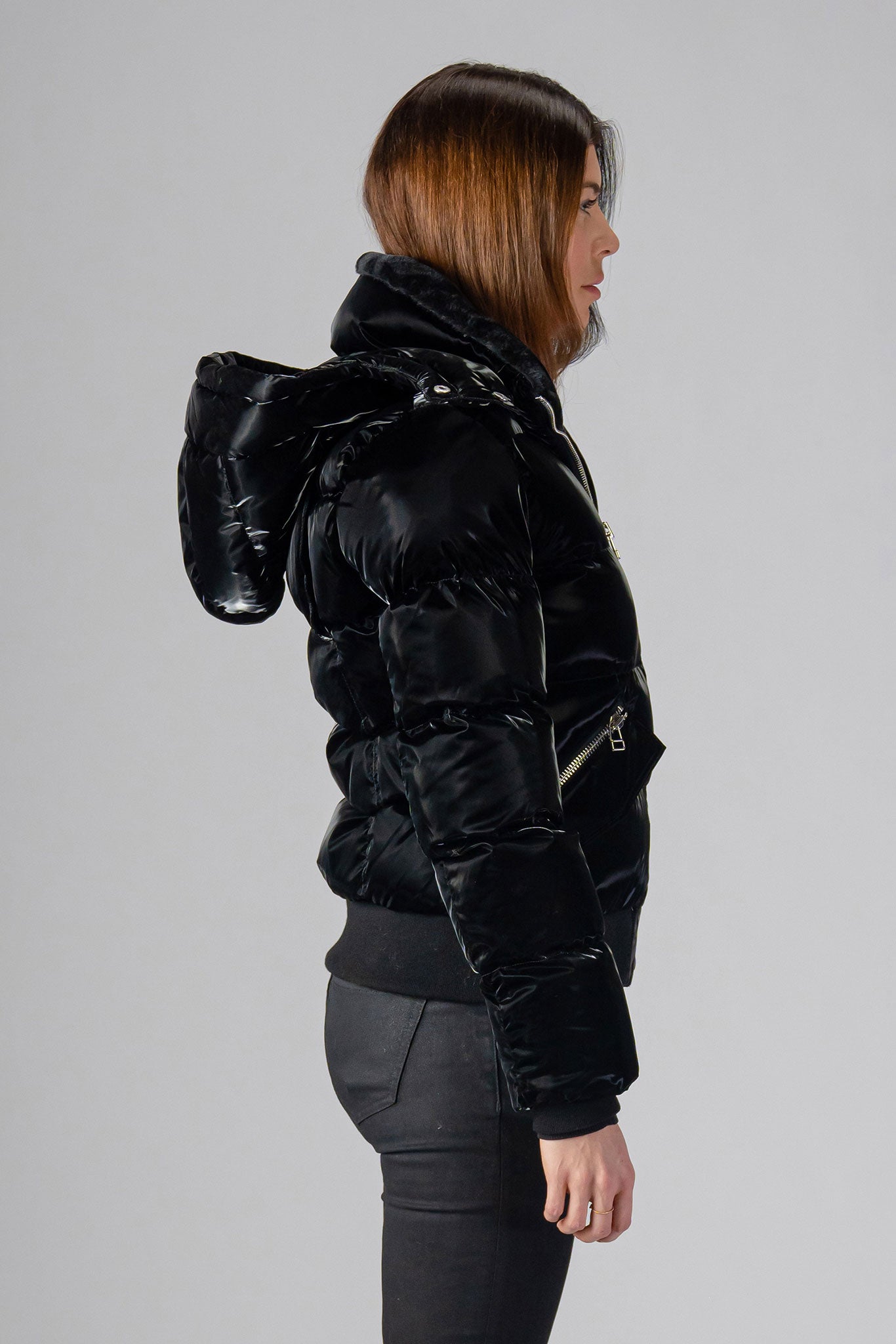 Woodpecker Women's Woody Bomber Winter coat. High-end Canadian designer winter coat for women in shiny “All Wet Black". Woodpecker cruelty-free winter coat designed in Canada. Women's heavy weight short length premium designer jacket for winter. Superior quality warm winter coat for women. Moose Knuckles, Canada Goose, Mackage, Montcler, Will Poho, Willbird, Nic Bayley. Shiny parka. Stylish winter jacket. Designer winter coat.