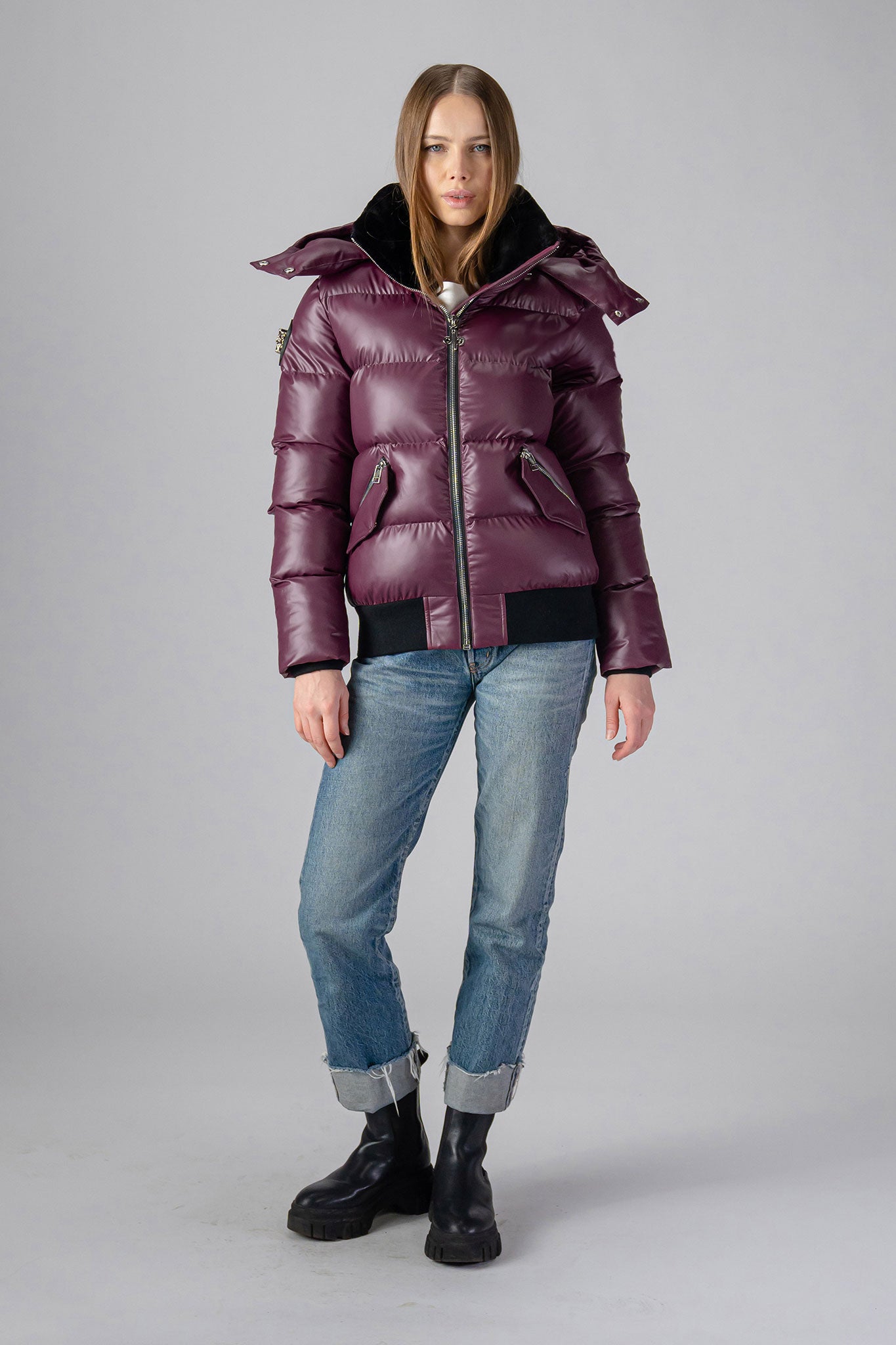 Woodpecker Women&#39;s Woody Bomber Winter coat. High-end Canadian designer winter coat for women in &quot;Plum&quot; colour. Woodpecker cruelty-free winter coat designed in Canada. Women&#39;s heavy weight short length premium designer jacket for winter. Superior quality warm winter coat for women. Moose Knuckles, Canada Goose, Mackage, Montcler, Will Poho, Willbird, Nic Bayley. Shiny parka. Stylish winter jacket. Designer winter coat.