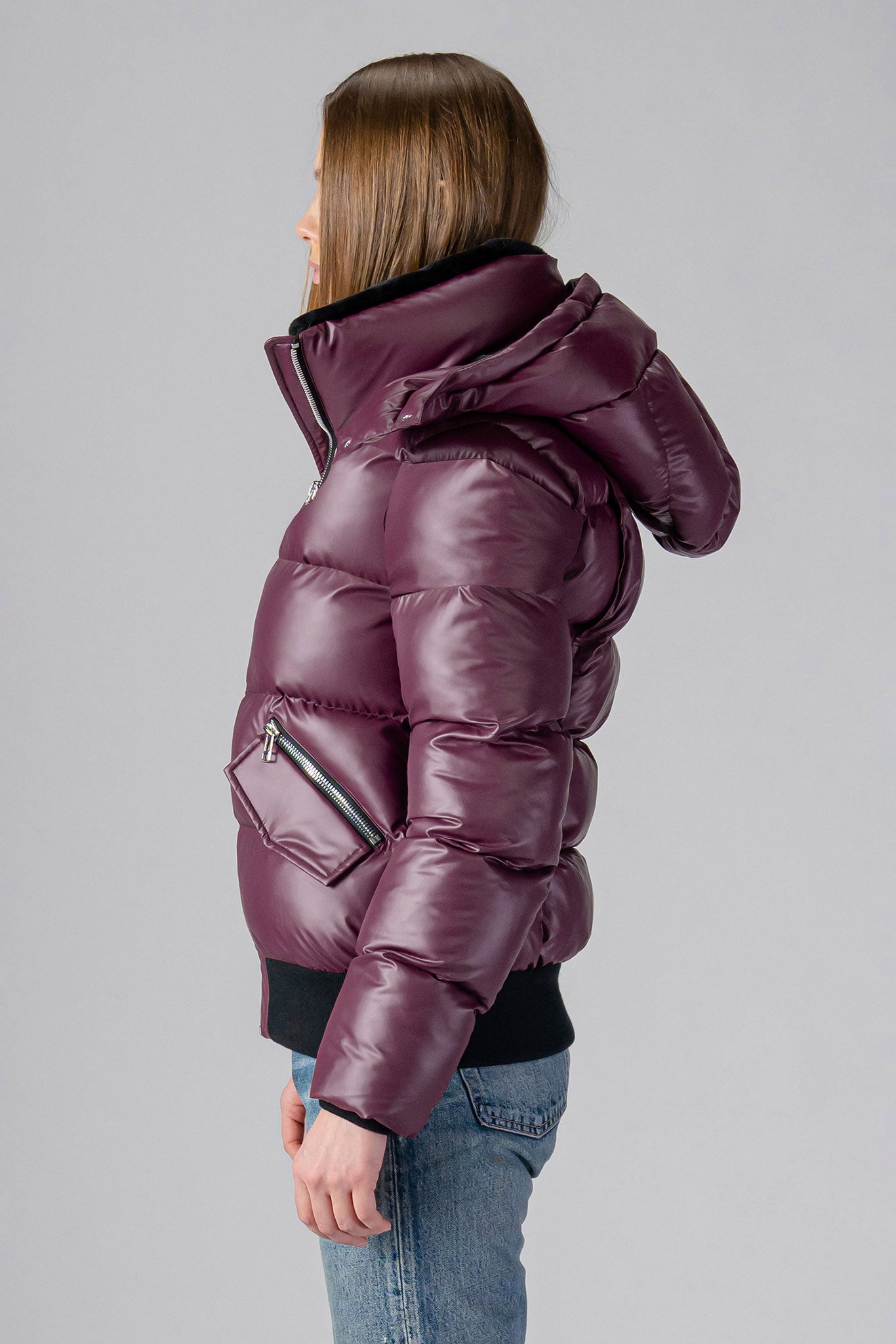 Woodpecker Women's Woody Bomber Winter coat. High-end Canadian designer winter coat for women in "Plum" colour. Woodpecker cruelty-free winter coat designed in Canada. Women's heavy weight short length premium designer jacket for winter. Superior quality warm winter coat for women. Moose Knuckles, Canada Goose, Mackage, Montcler, Will Poho, Willbird, Nic Bayley. Shiny parka. Stylish winter jacket. Designer winter coat.