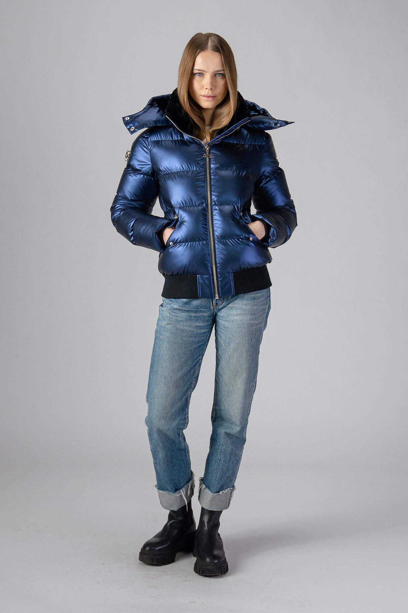 Woodpecker Women&#39;s Woody Bomber Winter coat. High-end Canadian designer winter coat for women in &quot;Sapphire&quot; colour. Woodpecker cruelty-free winter coat designed in Canada. Women&#39;s heavy weight short length premium designer jacket for winter. Superior quality warm winter coat for women. Moose Knuckles, Canada Goose, Mackage, Montcler, Will Poho, Willbird, Nic Bayley. Shiny parka. Stylish winter jacket. Designer winter coat.