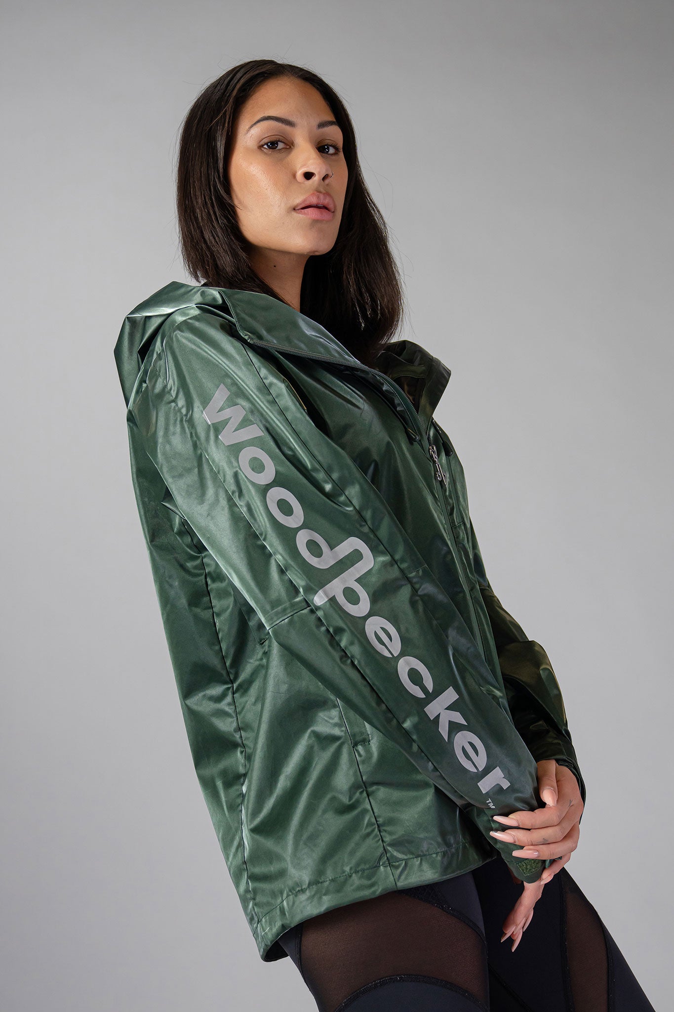 Woodpecker Women&#39;s Wind Shell coat. High-end Canadian designer activewear coat for women in &quot;Green Diamond&quot; colour. Woodpecker coat designed in Canada. Moose Knuckles, Canada Goose, Mackage, Montcler, Will Poho, Willbird, Nic Bayley.