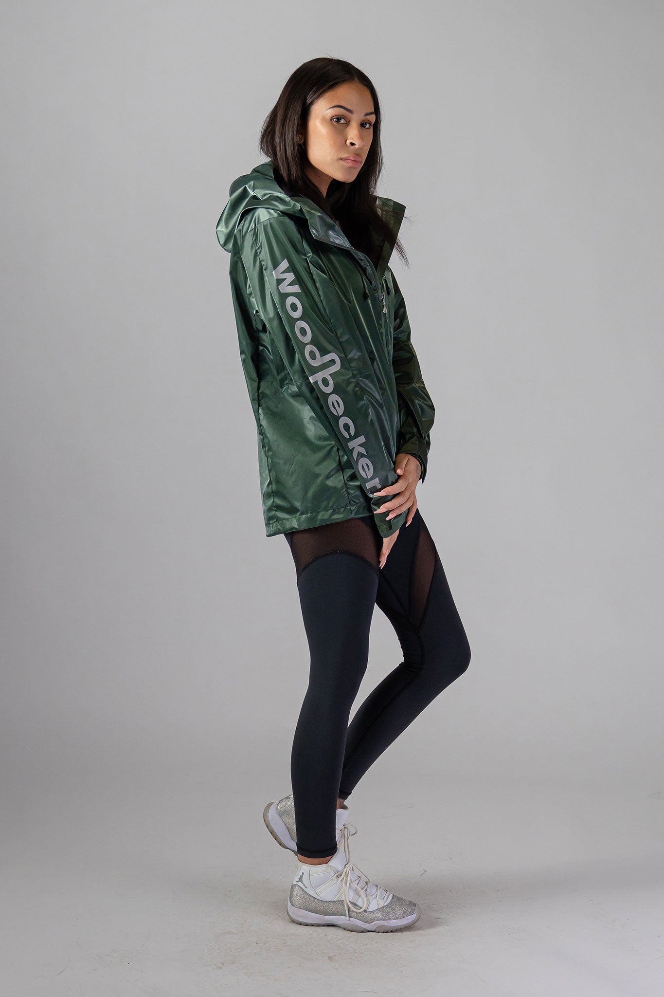 Woodpecker Women&#39;s Wind Shell coat. High-end Canadian designer activewear coat for women in &quot;Green Diamond&quot; colour. Woodpecker coat designed in Canada. Moose Knuckles, Canada Goose, Mackage, Montcler, Will Poho, Willbird, Nic Bayley.