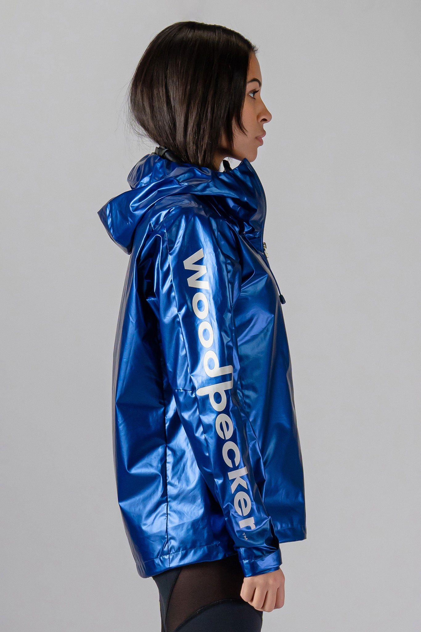 Woodpecker Women&#39;s Wind Shell coat. High-end Canadian designer activewear coat for women in &quot;Flash Blue&quot; colour. Woodpecker coat designed in Canada. Moose Knuckles, Canada Goose, Mackage, Montcler, Will Poho, Willbird, Nic Bayley.