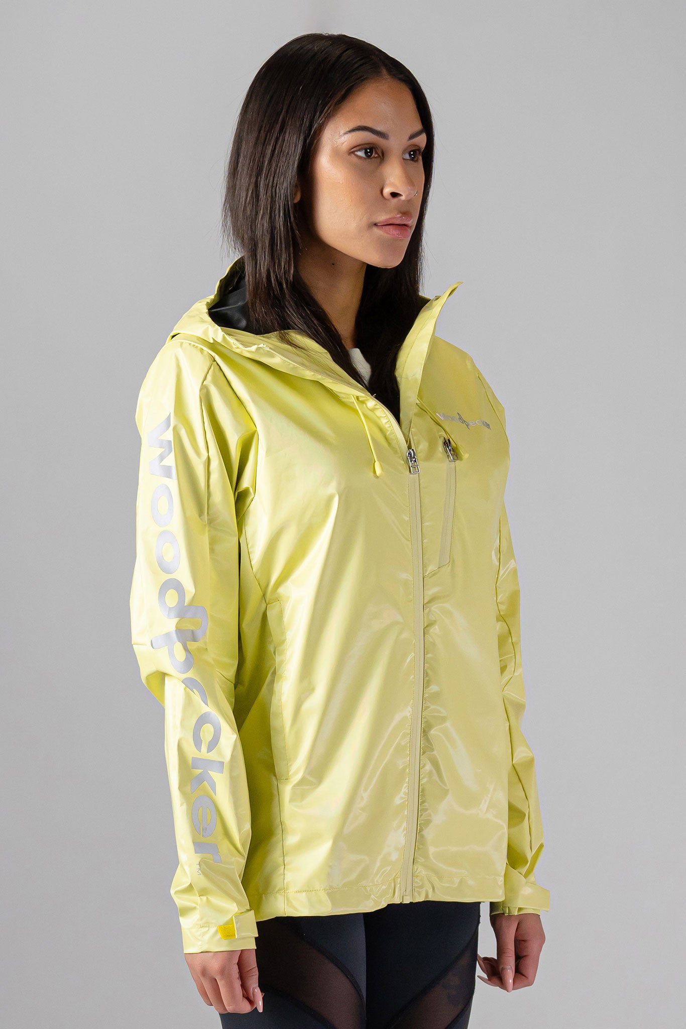 Woodpecker Women&#39;s Wind Shell coat. High-end Canadian designer activewear coat for women in &quot;Mellow Yellow&quot; colour. Woodpecker coat designed in Canada. Moose Knuckles, Canada Goose, Mackage, Montcler, Will Poho, Willbird, Nic Bayley.