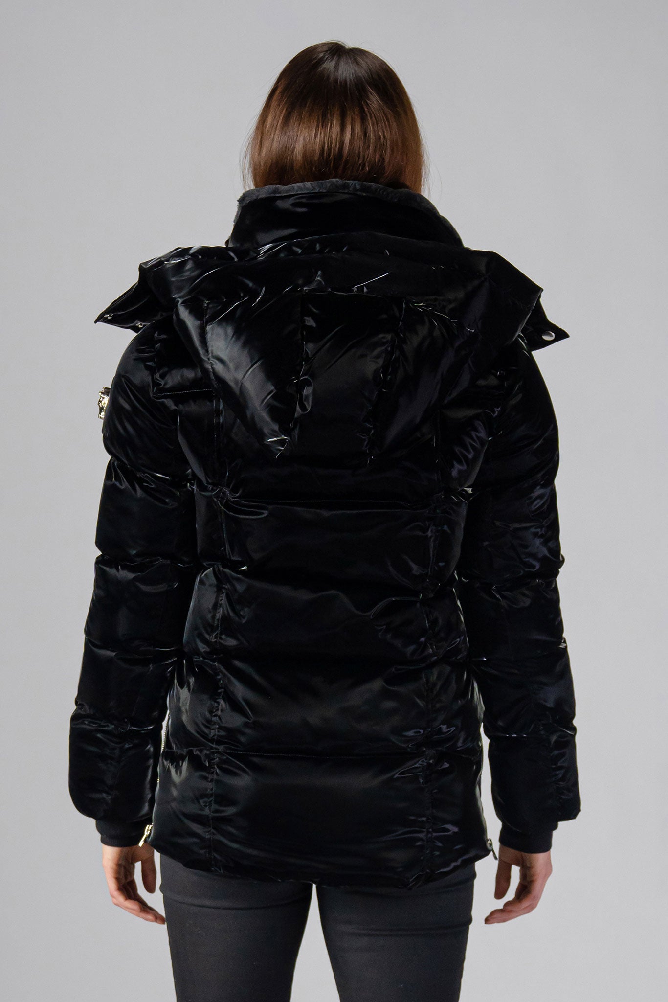 Woodpecker Women's Bumnester Winter coat. High-end Canadian designer winter coat for women in shiny "All Wet Black" colour. Woodpecker cruelty-free winter coat designed in Canada. Women's heavy weight medium length premium designer jacket for winter. Superior quality warm winter coat for women. Moose Knuckles, Canada Goose, Mackage, Montcler, Will Poho, Willbird, Nic Bayley. Extra warm. Shiny parka. Stylish winter jacket. Designer winter coat.