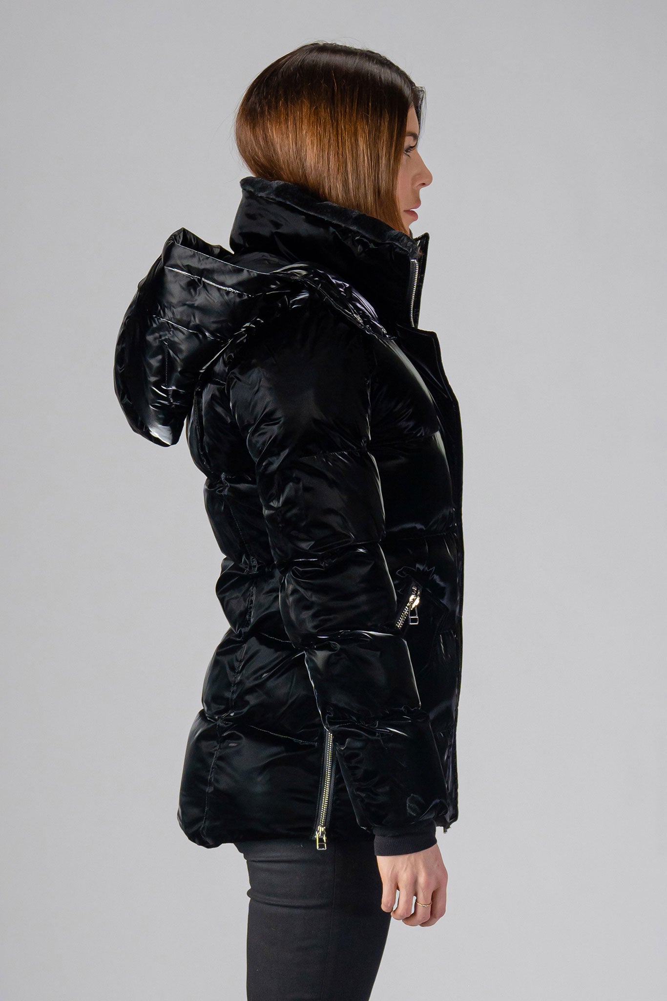 Woodpecker Women's Bumnester Winter coat. High-end Canadian designer winter coat for women in shiny "All Wet Black" colour. Woodpecker cruelty-free winter coat designed in Canada. Women's heavy weight medium length premium designer jacket for winter. Superior quality warm winter coat for women. Moose Knuckles, Canada Goose, Mackage, Montcler, Will Poho, Willbird, Nic Bayley. Extra warm. Shiny parka. Stylish winter jacket. Designer winter coat.