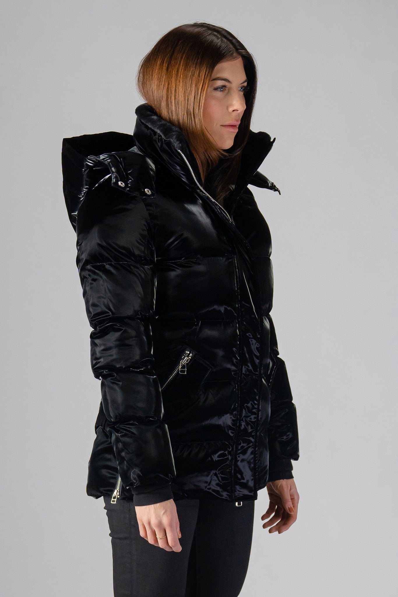 Woodpecker Women's Bumnester Winter coat. High-end Canadian designer winter coat for women in shiny "All Wet Black" colour. Woodpecker cruelty-free winter coat designed in Canada. Women's heavy weight medium length premium designer jacket for winter. Superior quality warm winter coat for women. Moose Knuckles, Canada Goose, Mackage, Montcler, Will Poho, Willbird, Nic Bayley. Extra warm. Shiny parka. Stylish winter jacket. Designer winter coat.