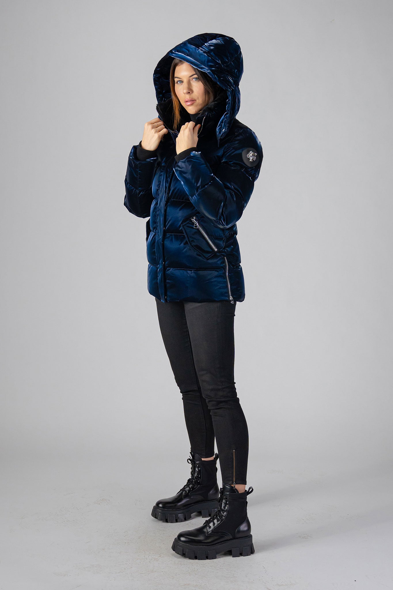 Woodpecker Women's Bumnester Winter coat. High-end Canadian designer winter coat for women in shiny "All Wet Navy" colour. Woodpecker cruelty-free winter coat designed in Canada. Women's heavy weight medium length premium designer jacket for winter. Superior quality warm winter coat for women. Moose Knuckles, Canada Goose, Mackage, Montcler, Will Poho, Willbird, Nic Bayley. Extra warm. Shiny parka. Stylish winter jacket. Designer winter coat.