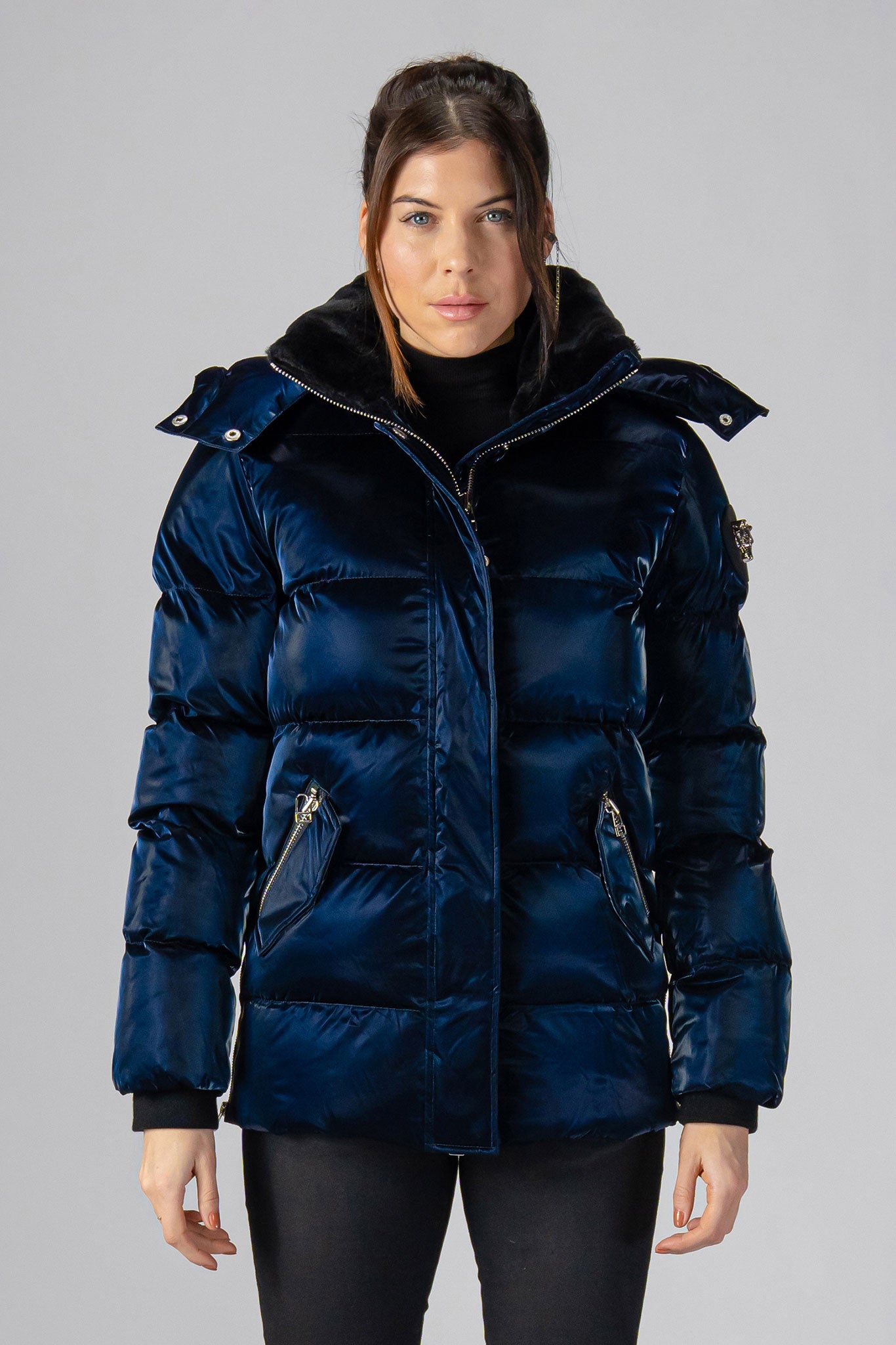 Woodpecker Women&#39;s Bumnester Winter coat. High-end Canadian designer winter coat for women in shiny &quot;All Wet Navy&quot; colour. Woodpecker cruelty-free winter coat designed in Canada. Women&#39;s heavy weight medium length premium designer jacket for winter. Superior quality warm winter coat for women. Moose Knuckles, Canada Goose, Mackage, Montcler, Will Poho, Willbird, Nic Bayley. Extra warm. Shiny parka. Stylish winter jacket. Designer winter coat.