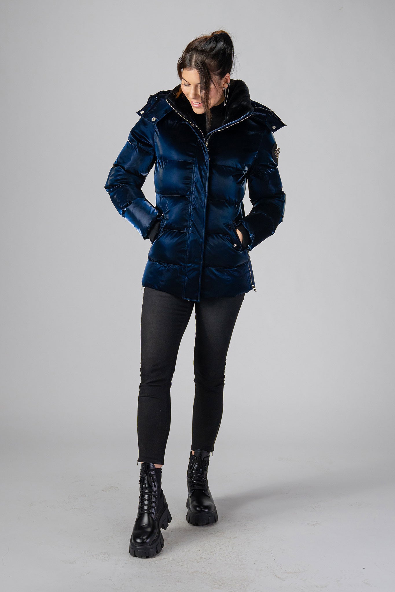 Woodpecker Women's Bumnester Winter coat. High-end Canadian designer winter coat for women in shiny "All Wet Navy" colour. Woodpecker cruelty-free winter coat designed in Canada. Women's heavy weight medium length premium designer jacket for winter. Superior quality warm winter coat for women. Moose Knuckles, Canada Goose, Mackage, Montcler, Will Poho, Willbird, Nic Bayley. Extra warm. Shiny parka. Stylish winter jacket. Designer winter coat.