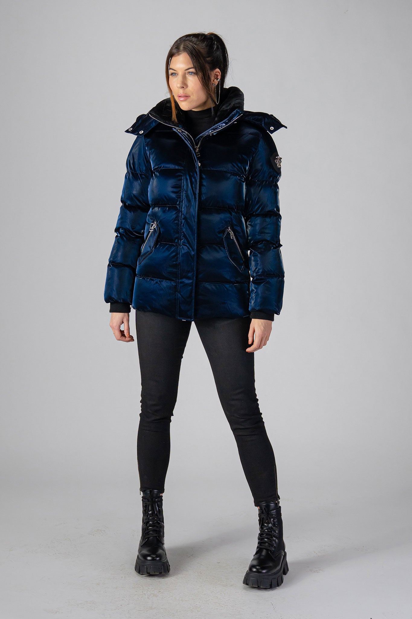 Woodpecker Women's Bumnester Winter coat. High-end Canadian designer winter coat for women in shiny "All Wet Navy" colour. Woodpecker cruelty-free winter coat designed in Canada. Women's heavy weight medium length premium designer jacket for winter. Superior quality warm winter coat for women. Moose Knuckles, Canada Goose, Mackage, Montcler, Will Poho, Willbird, Nic Bayley. Extra warm. Shiny parka. Stylish winter jacket. Designer winter coat.