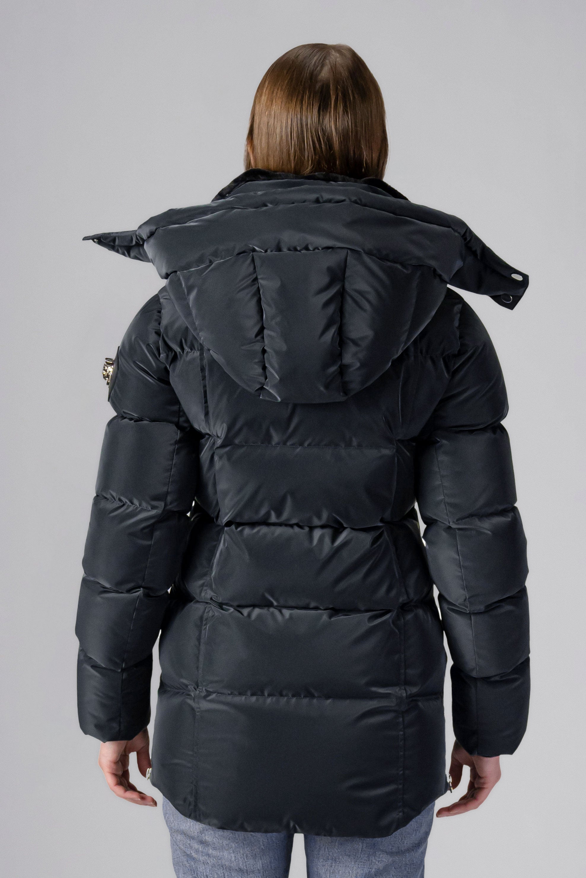 Woodpecker Women&#39;s Bumnester Winter coat. High-end Canadian designer winter coat for women in shiny &quot;Black Diamond&quot; colour. Woodpecker cruelty-free winter coat designed in Canada. Women&#39;s heavy weight medium length premium designer jacket for winter. Superior quality warm winter coat for women. Moose Knuckles, Canada Goose, Mackage, Montcler, Will Poho, Willbird, Nic Bayley. Extra warm. Shiny parka. Stylish winter jacket. Designer winter coat.