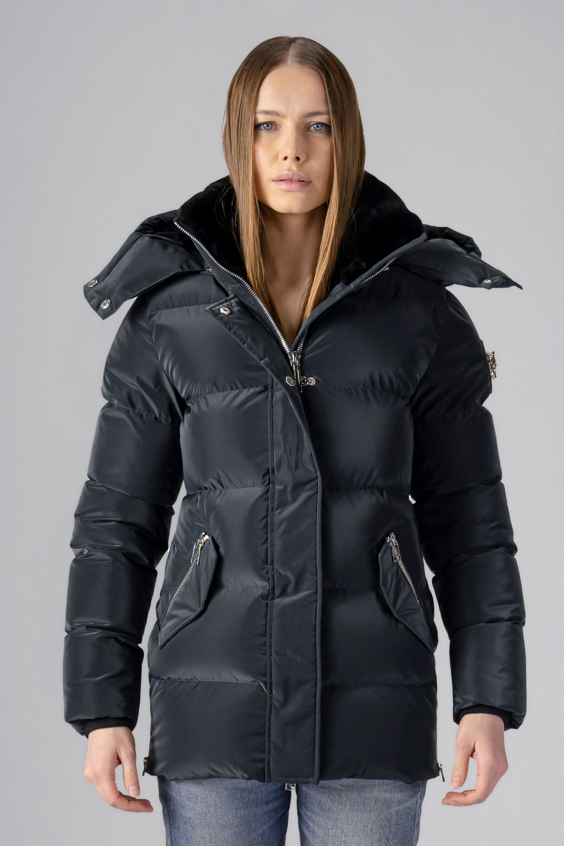 Woodpecker Women&#39;s Bumnester Winter coat. High-end Canadian designer winter coat for women in shiny &quot;Black Diamond&quot; colour. Woodpecker cruelty-free winter coat designed in Canada. Women&#39;s heavy weight medium length premium designer jacket for winter. Superior quality warm winter coat for women. Moose Knuckles, Canada Goose, Mackage, Montcler, Will Poho, Willbird, Nic Bayley. Extra warm. Shiny parka. Stylish winter jacket. Designer winter coat.