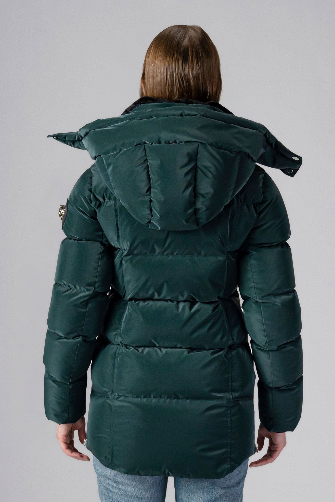 Woodpecker Women&#39;s Bumnester Winter coat. High-end Canadian designer winter coat for women in shiny &quot;Green Diamond&quot; colour. Woodpecker cruelty-free winter coat designed in Canada. Women&#39;s heavy weight medium length premium designer jacket for winter. Superior quality warm winter coat for women. Moose Knuckles, Canada Goose, Mackage, Montcler, Will Poho, Willbird, Nic Bayley. Extra warm. Shiny parka. Stylish winter jacket. Designer winter coat.