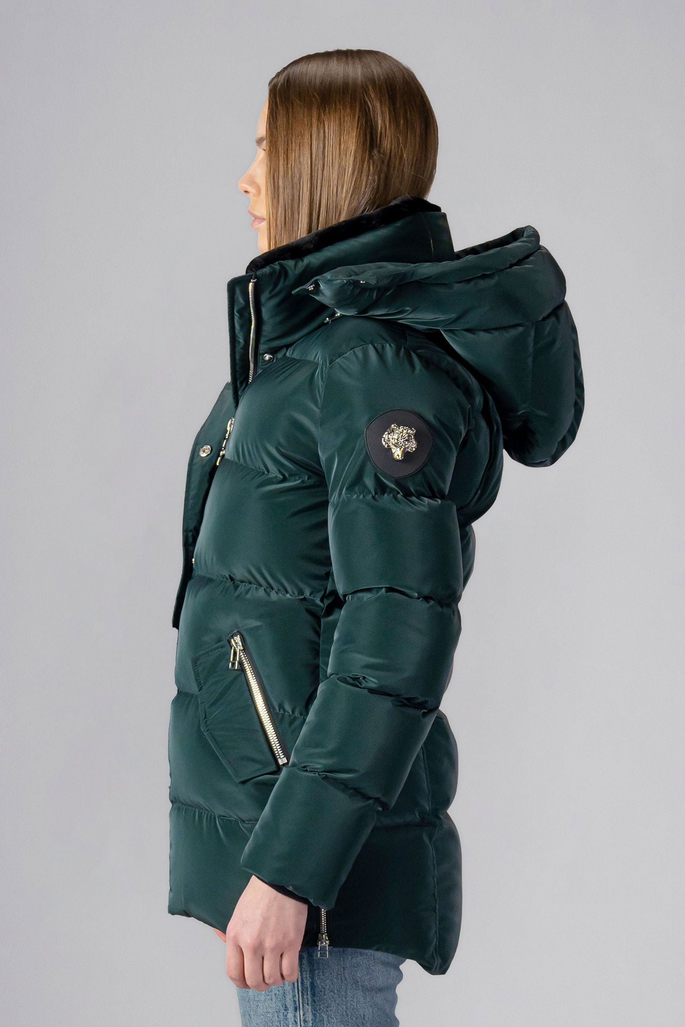 Woodpecker Women&#39;s Bumnester Winter coat. High-end Canadian designer winter coat for women in shiny &quot;Green Diamond&quot; colour. Woodpecker cruelty-free winter coat designed in Canada. Women&#39;s heavy weight medium length premium designer jacket for winter. Superior quality warm winter coat for women. Moose Knuckles, Canada Goose, Mackage, Montcler, Will Poho, Willbird, Nic Bayley. Extra warm. Shiny parka. Stylish winter jacket. Designer winter coat.