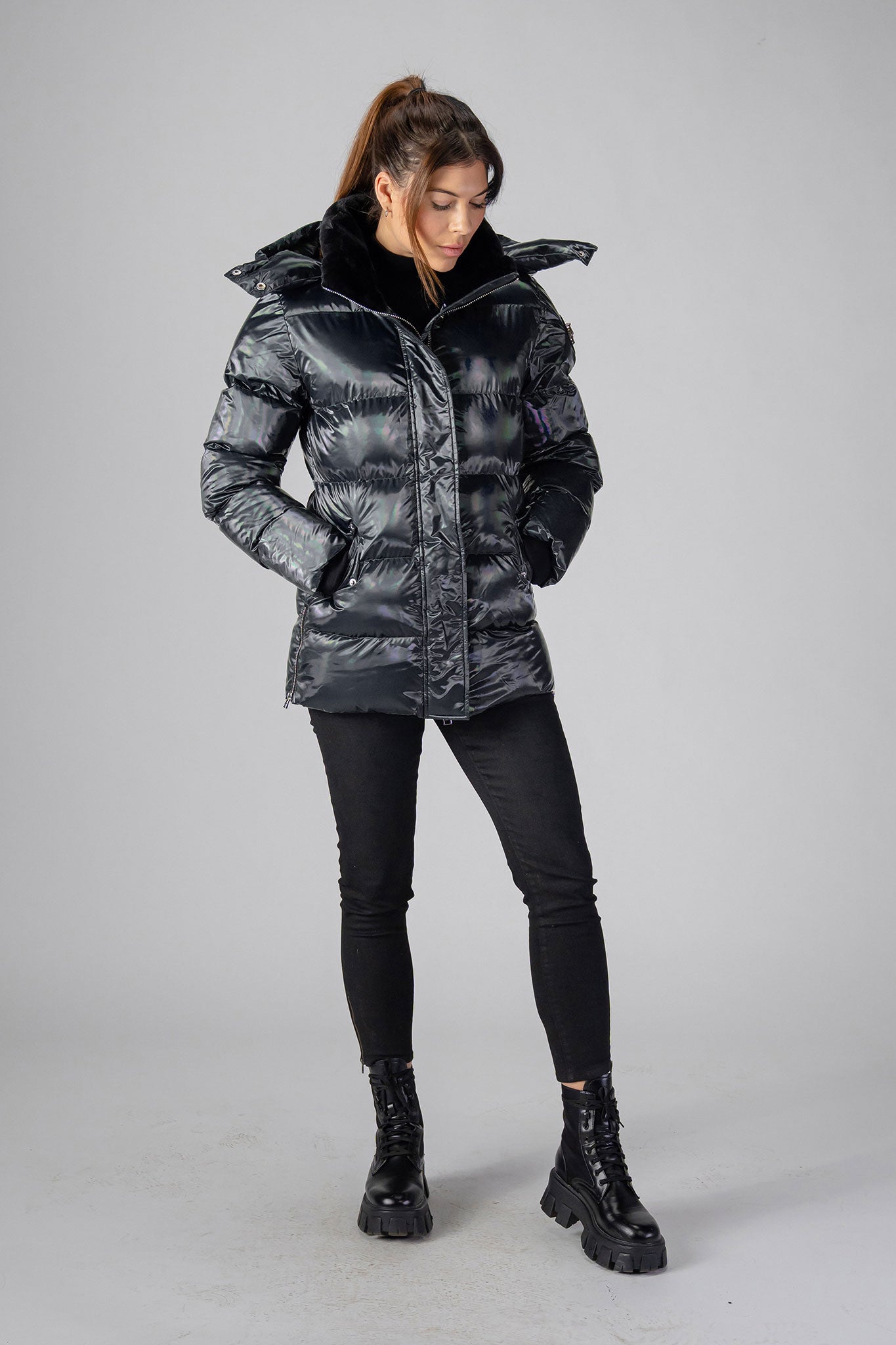 Woodpecker Women&#39;s Bumnester Winter coat. High-end Canadian designer winter coat for women in &quot;Oily Black&quot; colour. Woodpecker cruelty-free winter coat designed in Canada. Women&#39;s heavy weight medium length premium designer jacket for winter. Superior quality warm winter coat for women. Moose Knuckles, Canada Goose, Mackage, Montcler, Will Poho, Willbird, Nic Bayley. Extra warm. Shiny parka. Stylish winter jacket. Designer winter coat.