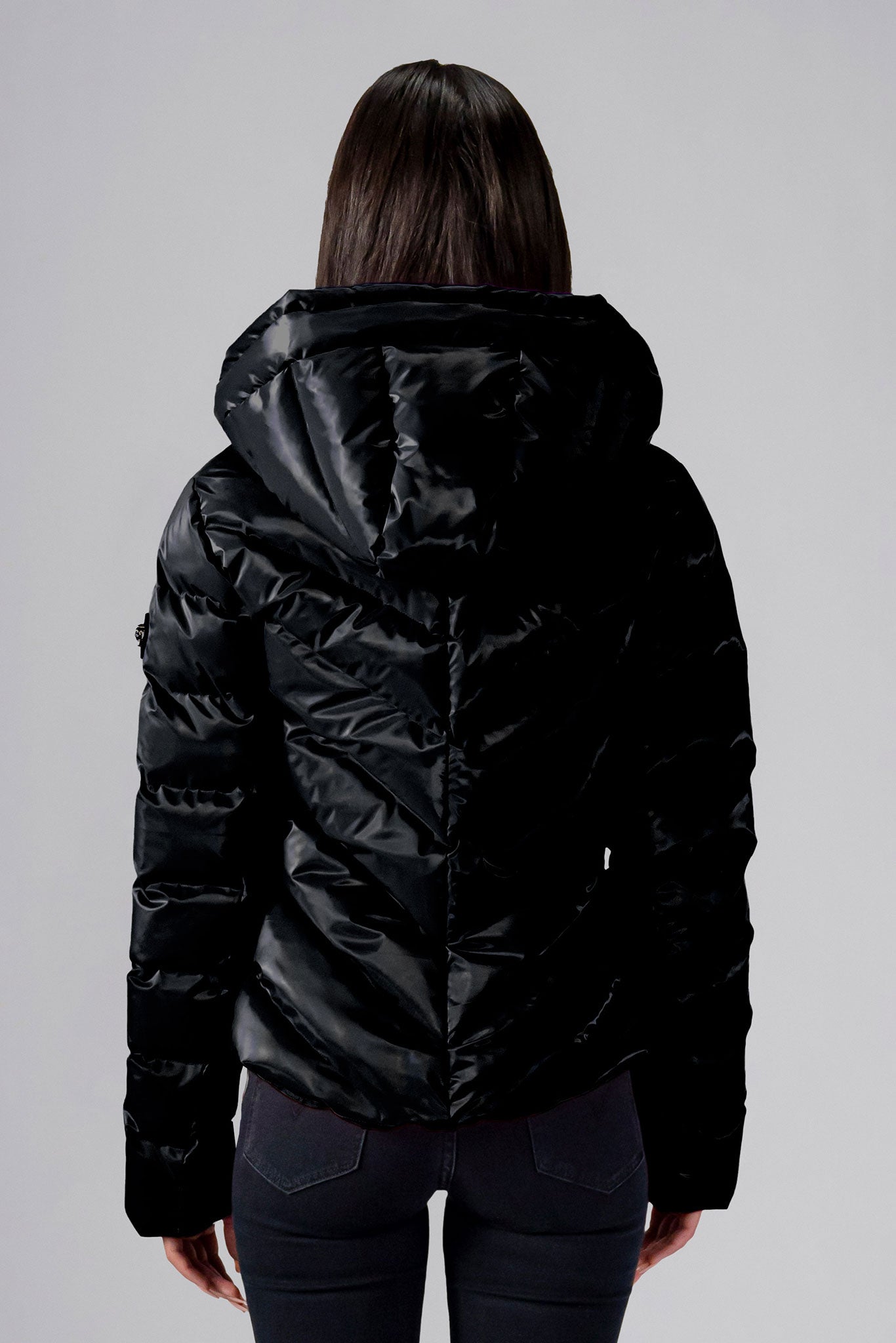 Woodpecker Women&#39;s Robin Winter coat. High-end Canadian designer winter coat for women in &quot;All Wet Black&quot; colour. Woodpecker cruelty-free winter coat designed in Canada. Women&#39;s medium weight medium length premium designer jacket for winter. Superior quality warm winter coat for women. Moose Knuckles, Canada Goose, Mackage, Montcler, Will Poho, Willbird, Nic Bayley. Extra warm. Shiny parka. Stylish winter jacket. Designer winter coat.