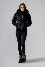 Load image into Gallery viewer, Woodpecker Women&#39;s Robin Winter coat. High-end Canadian designer winter coat for women in &quot;All Wet Black&quot; colour. Woodpecker cruelty-free winter coat designed in Canada. Women&#39;s medium weight medium length premium designer jacket for winter. Superior quality warm winter coat for women. Moose Knuckles, Canada Goose, Mackage, Montcler, Will Poho, Willbird, Nic Bayley. Extra warm. Shiny parka. Stylish winter jacket. Designer winter coat.
